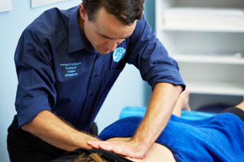 physio giving a deep tissue massage